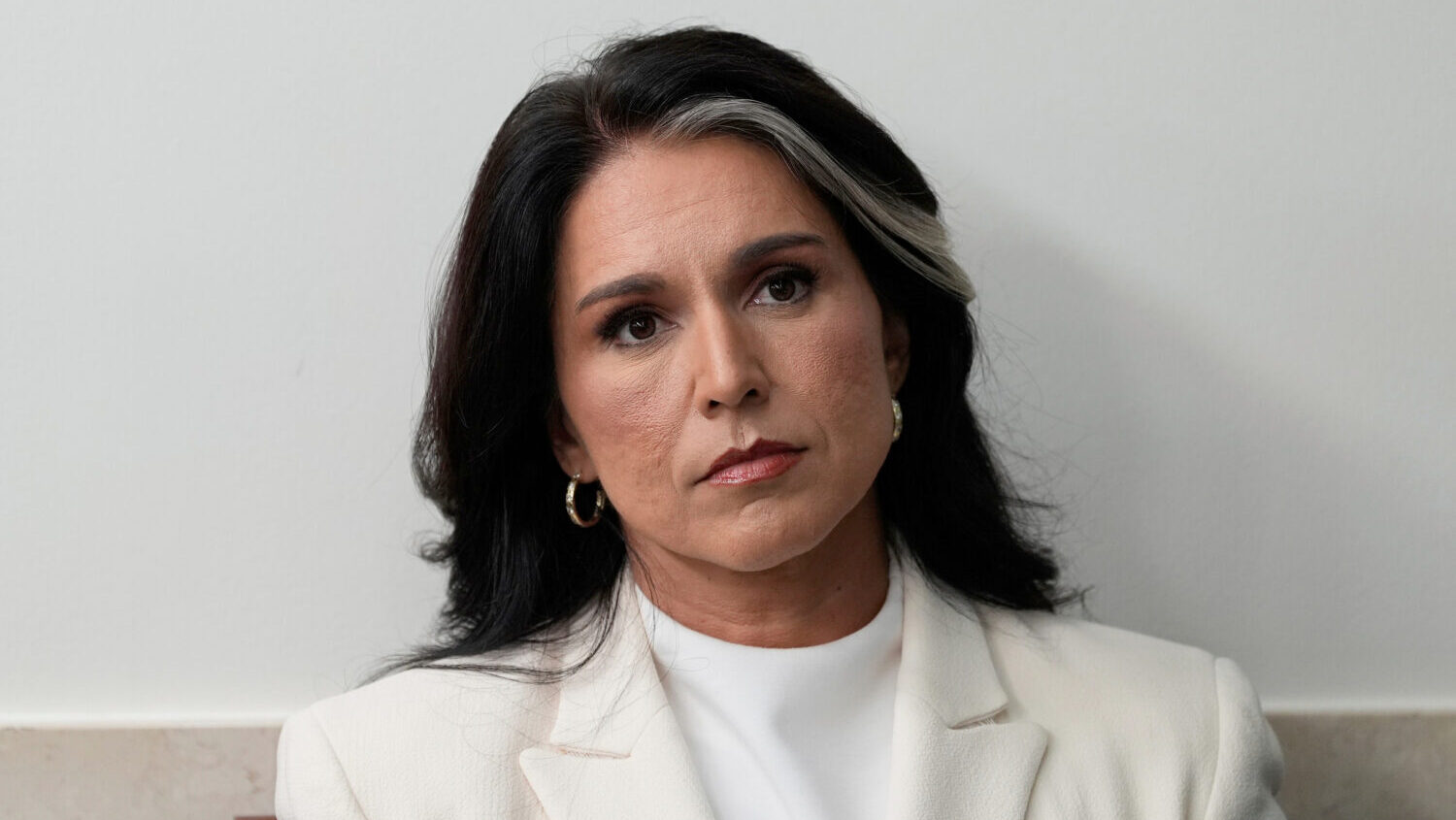FILE - Director of National Intelligence Tulsi Gabbard sits in the James Brady Press Briefing Room ...