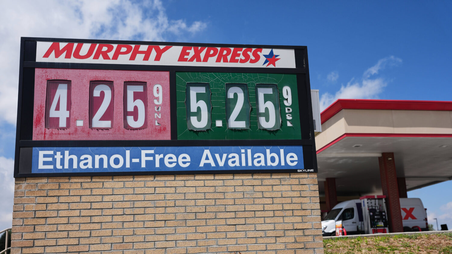 The per-gallon prices for regular unleaded and diesel fuel are displayed on a sign outside a Murphy...