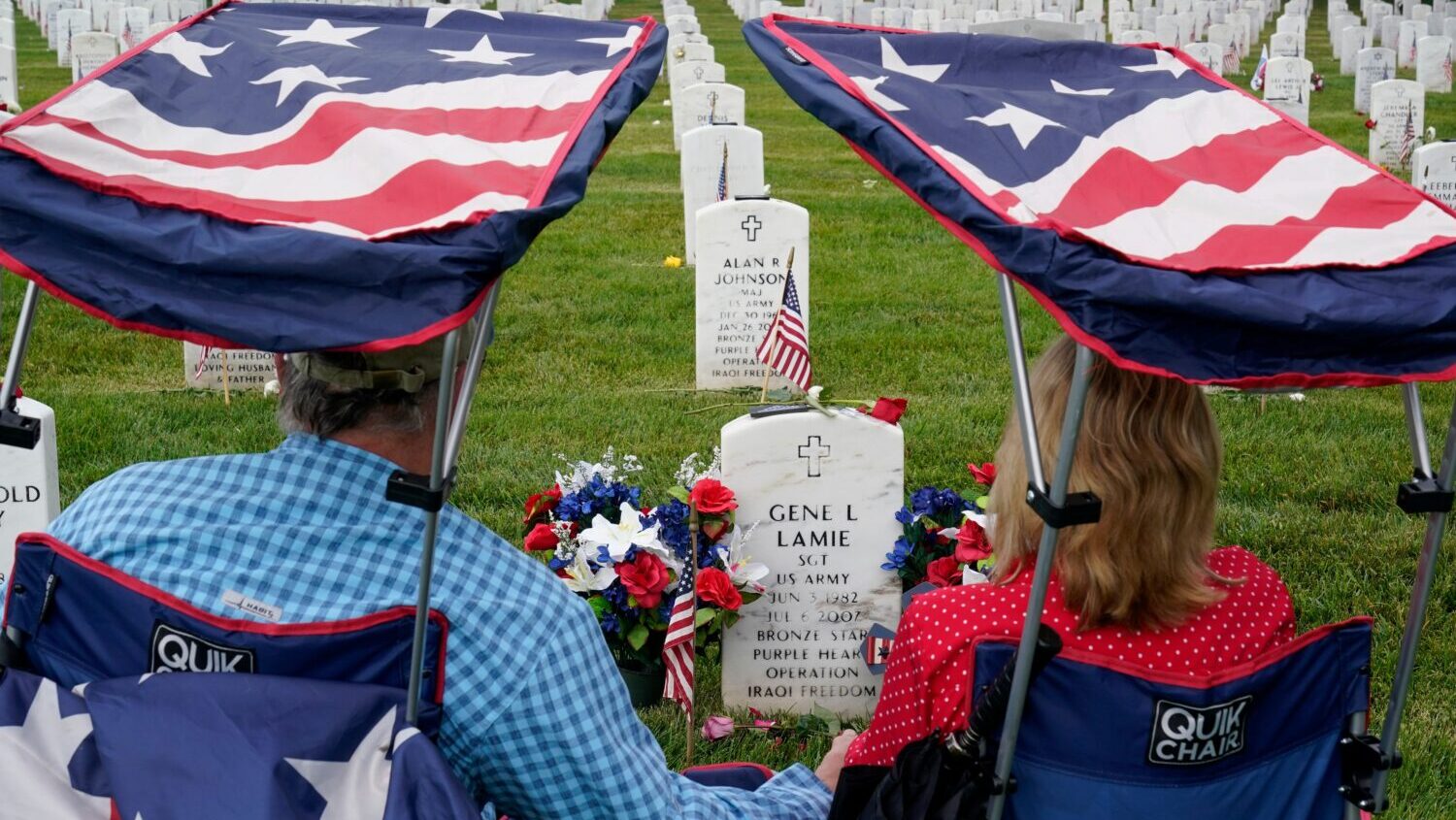 FILE - Eugene and Linda Lamie, of Homerville, Ga., sit by the grave of their son U.S. Army Sgt. Gen...