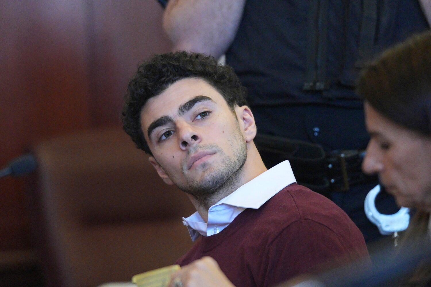 FILE - Luigi Mangione appears in Manhattan Criminal court, Dec. 23, 2024, in New York. (Curtis Mean...