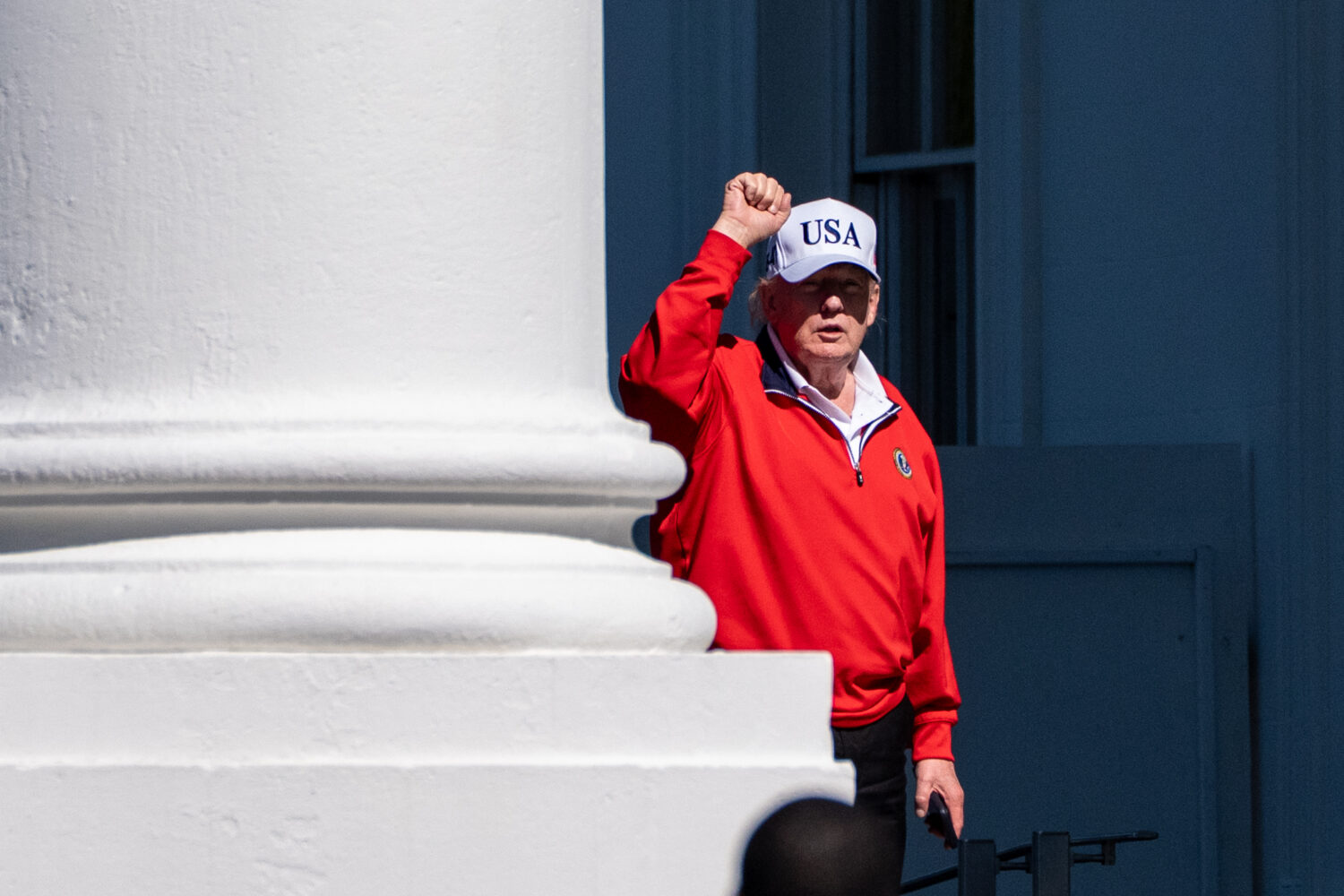 President Donald Trump pumps his fist as he arrives at the White House, Sunday, May 31, 2026, in Wa...